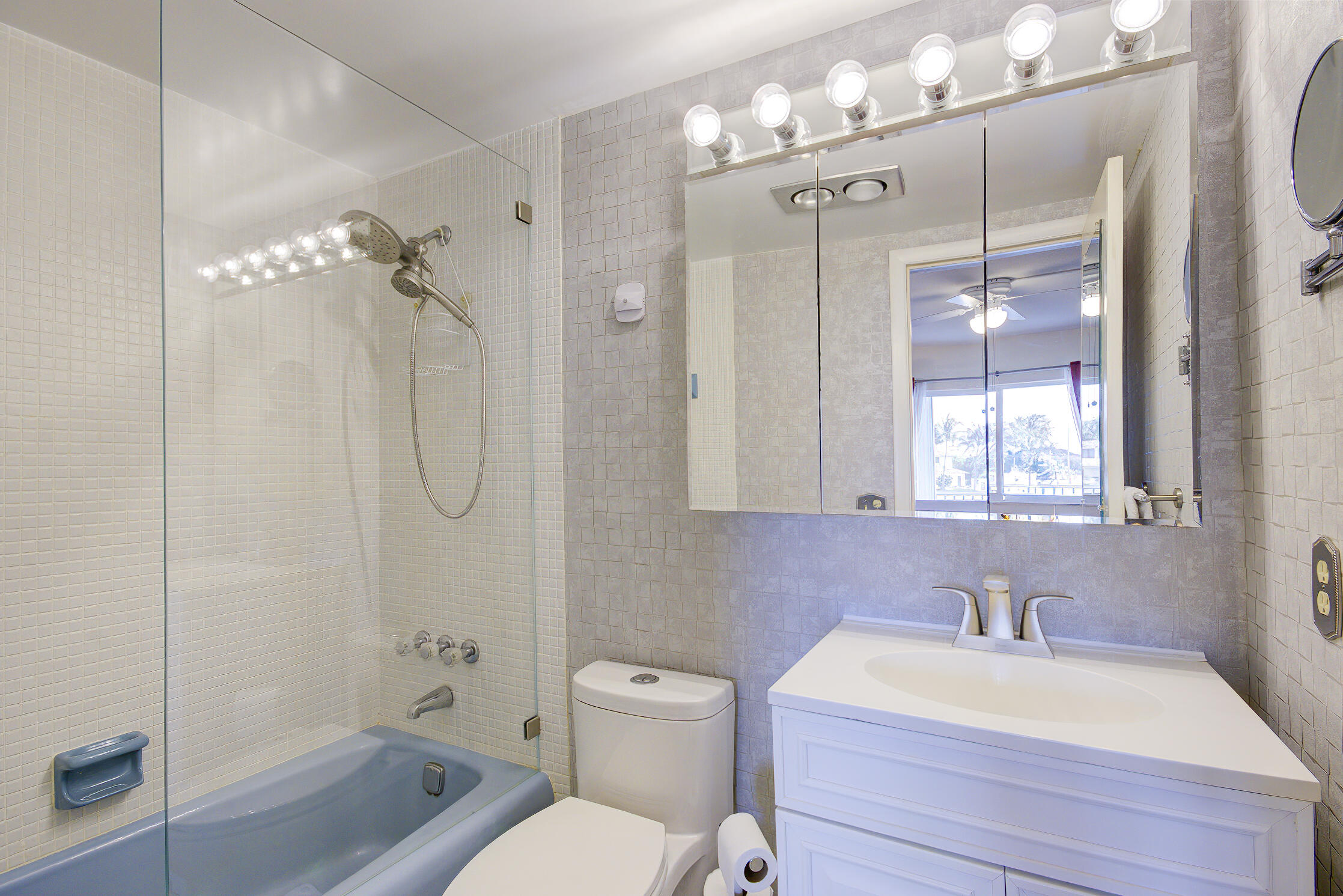 3100 South Ocean Boulevard, Unit 216 Highland Beach, FL 33487 - Photo 18 of 34 a bathroom with a sink a toilet and shower