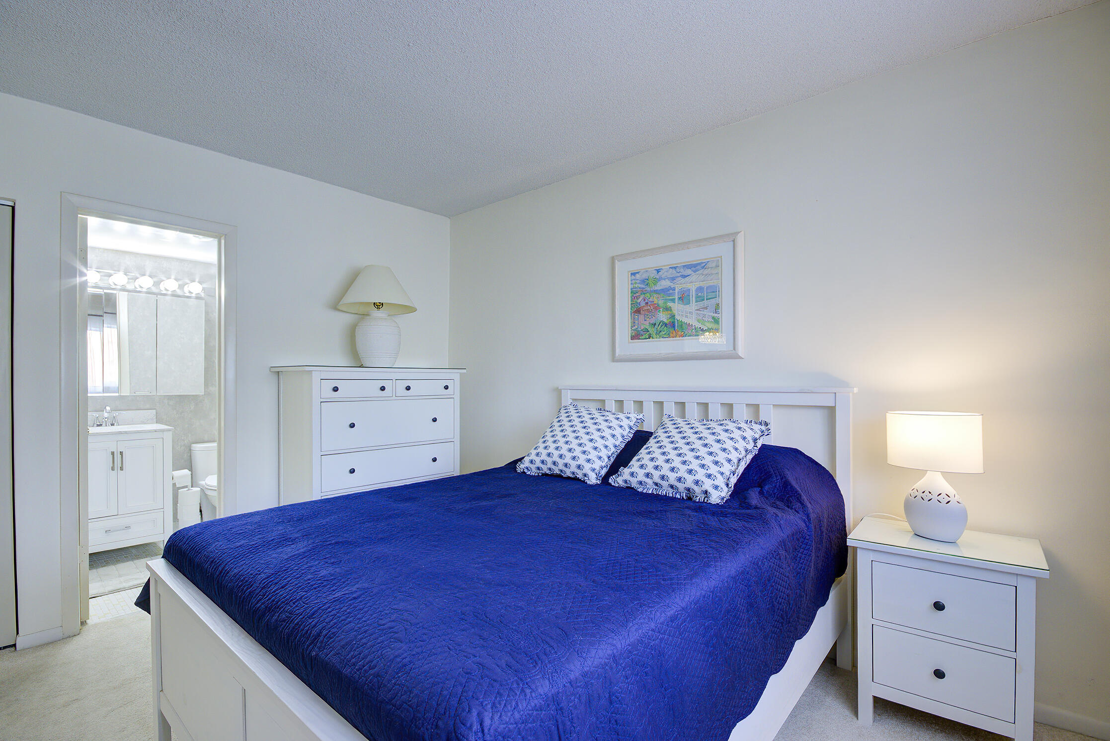 3100 South Ocean Boulevard, Unit 216 Highland Beach, FL 33487 - Photo 20 of 34 a bed room with a bed and a dresser