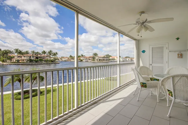a view of a chairs and table in the balcony