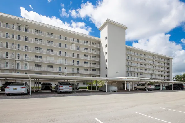 a view of a lake with a house in the background