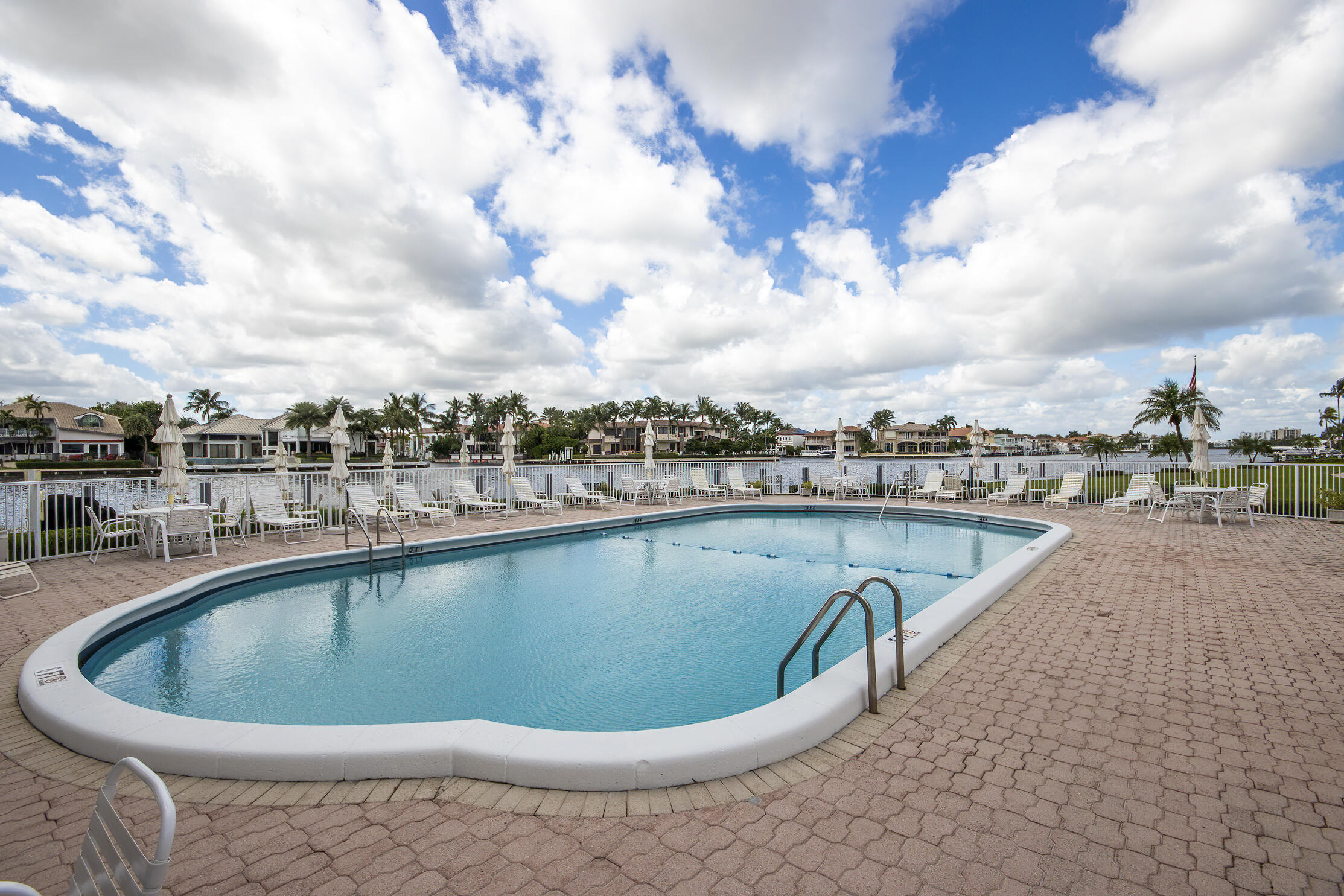 3100 South Ocean Boulevard, Unit 216 Highland Beach, FL 33487 - Photo 25 of 34 a view of a swimming pool and a lot of buildings in the background