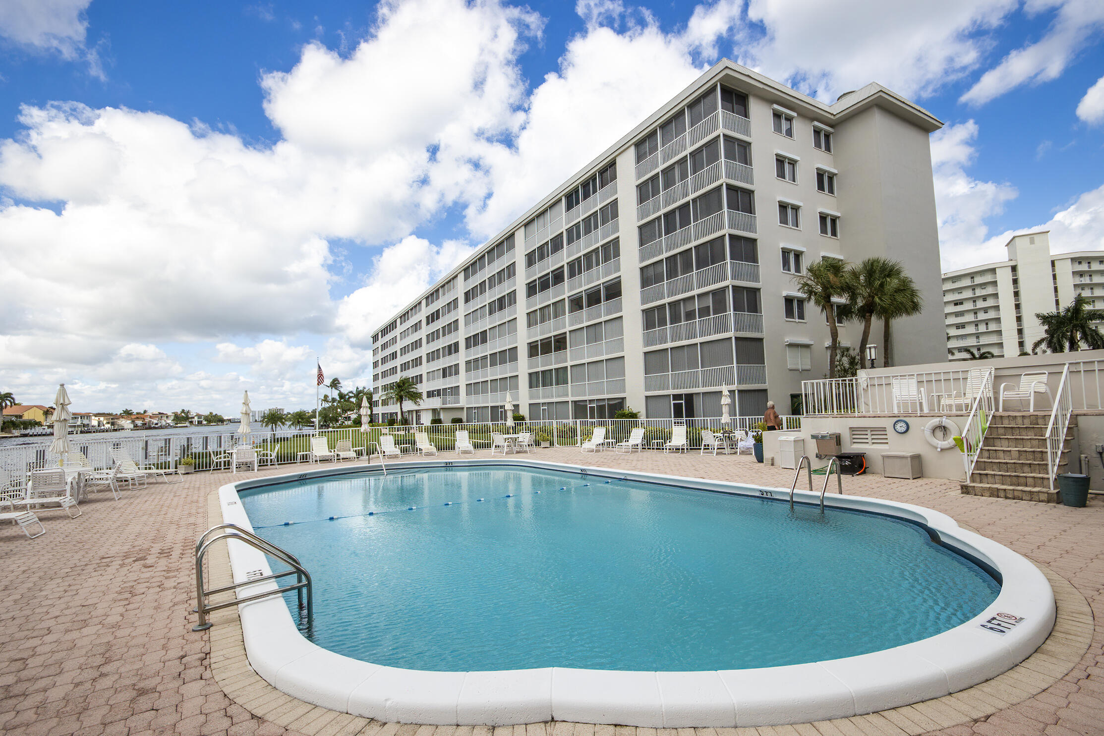 3100 South Ocean Boulevard, Unit 216 Highland Beach, FL 33487 - Photo 26 of 34 a view of a swimming pool with outdoor seating
