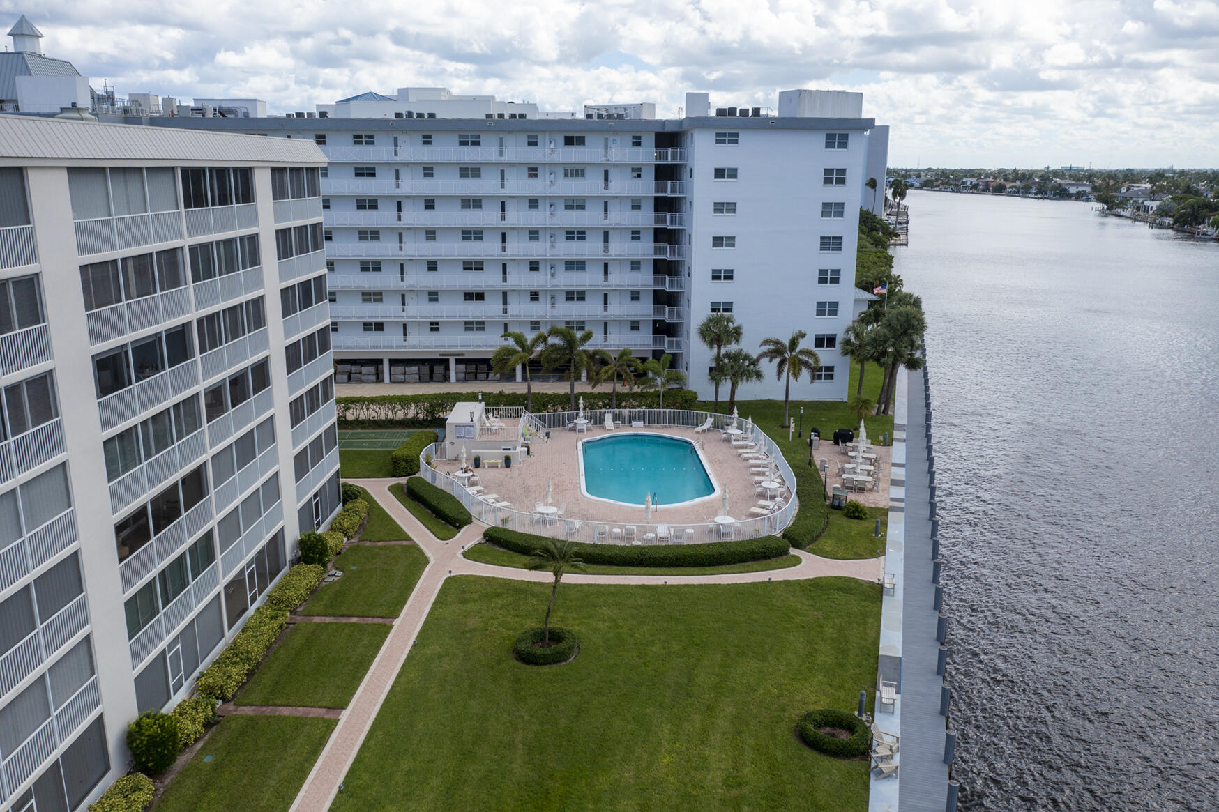 3100 South Ocean Boulevard, Unit 216 Highland Beach, FL 33487 - Photo 31 of 34 a aerial view of a residential apartment building with a yard
