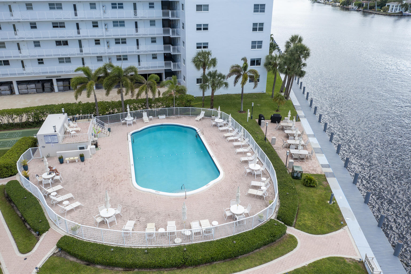 3100 South Ocean Boulevard, Unit 216 Highland Beach, FL 33487 - Photo 32 of 34 a view of a swimming pool with a yard