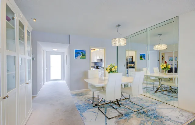a view of kitchen with furniture and floor to ceiling window
