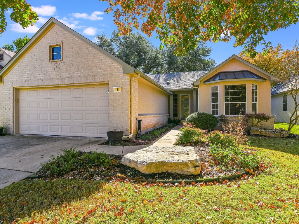 131 Trail Rider Way Georgetown, TX 78633 - Photo 1 of 1 a front view of a house with a yard and garage