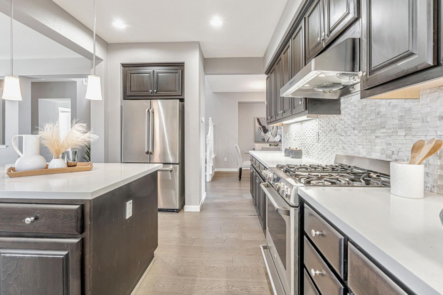 310 Villa Street Mountain View, CA 94041 - Photo 15 of 40 a kitchen with stainless steel appliances granite countertop a sink stove and refrigerator