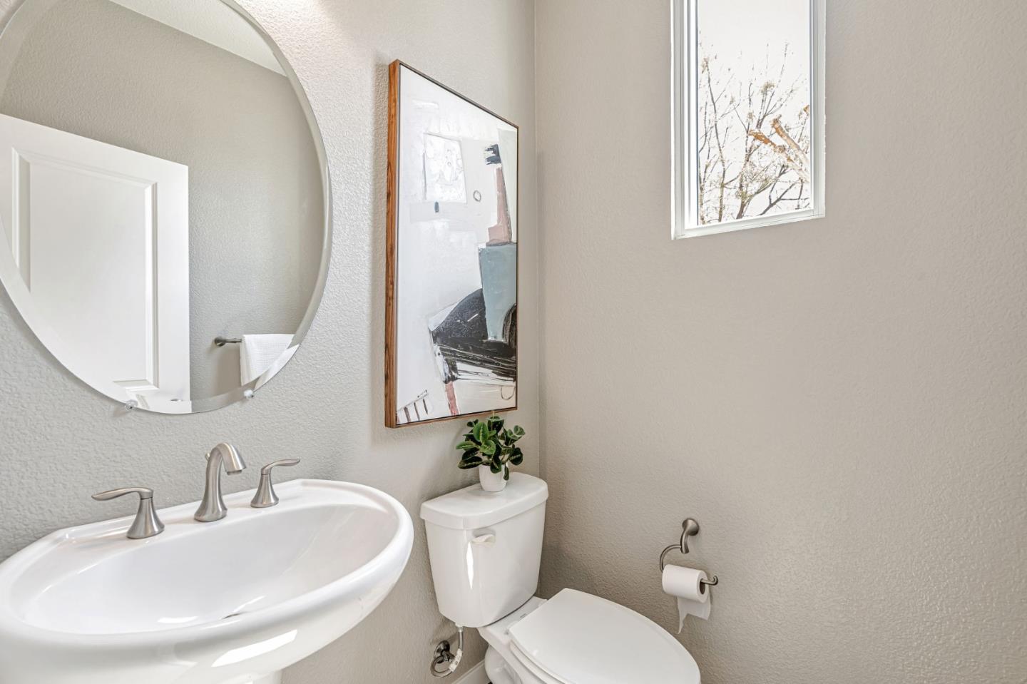 310 Villa Street Mountain View, CA 94041 - Photo 33 of 40 a bathroom with a toilet a sink and mirror