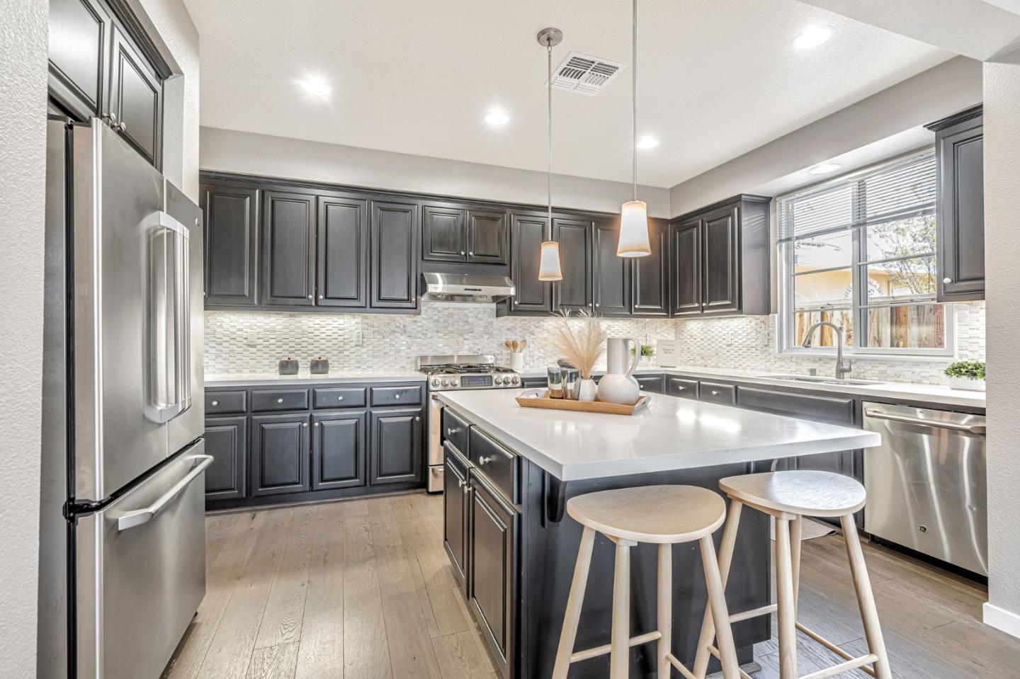 310 Villa Street Mountain View, CA 94041 - Photo 8 of 40 a kitchen with granite countertop a sink stove and refrigerator