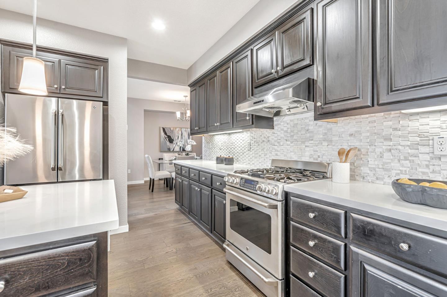 310 Villa Street Mountain View, CA 94041 - Photo 10 of 40 a kitchen with stainless steel appliances granite countertop a stove a refrigerator and a refrigerator