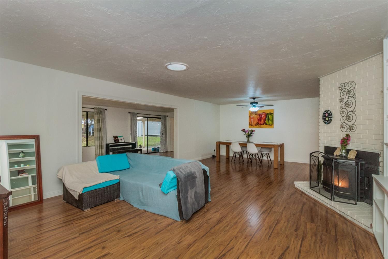 1783 North De Wolf Avenue Clovis, CA 93619 - Photo 13 of 39 a living room with furniture and wooden floor