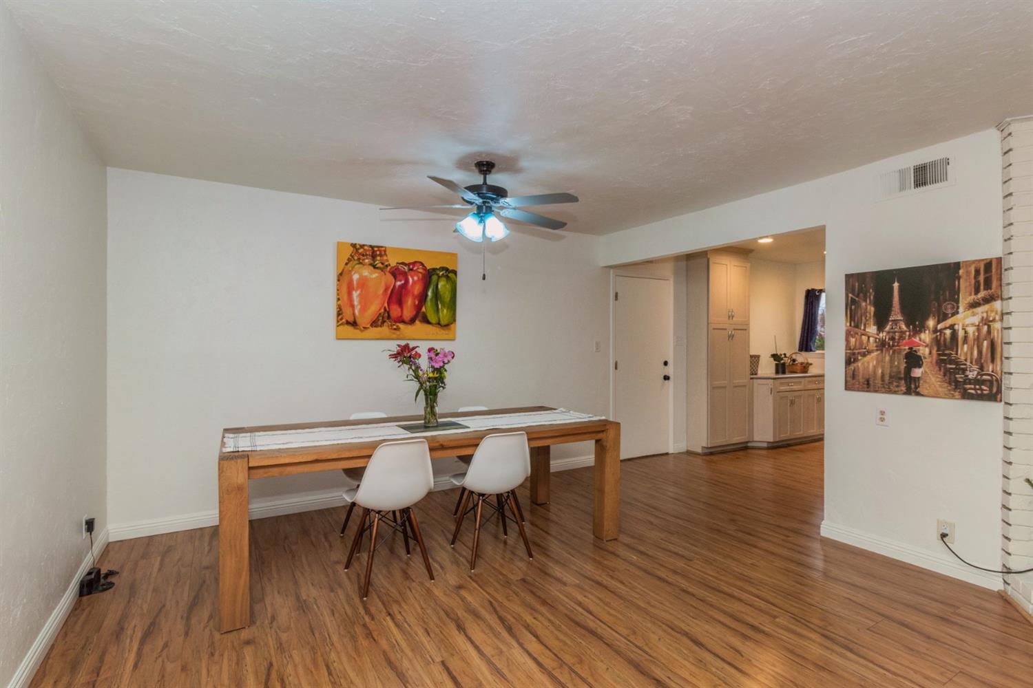 1783 North De Wolf Avenue Clovis, CA 93619 - Photo 14 of 39 a view of a dining room with furniture and wooden floor
