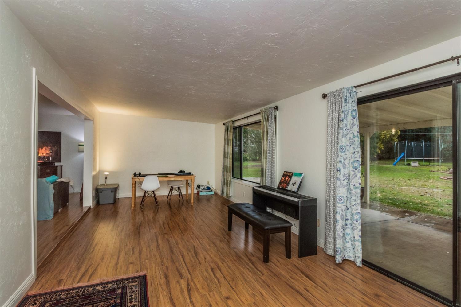 1783 North De Wolf Avenue Clovis, CA 93619 - Photo 15 of 39 a dining room with furniture and wooden floor