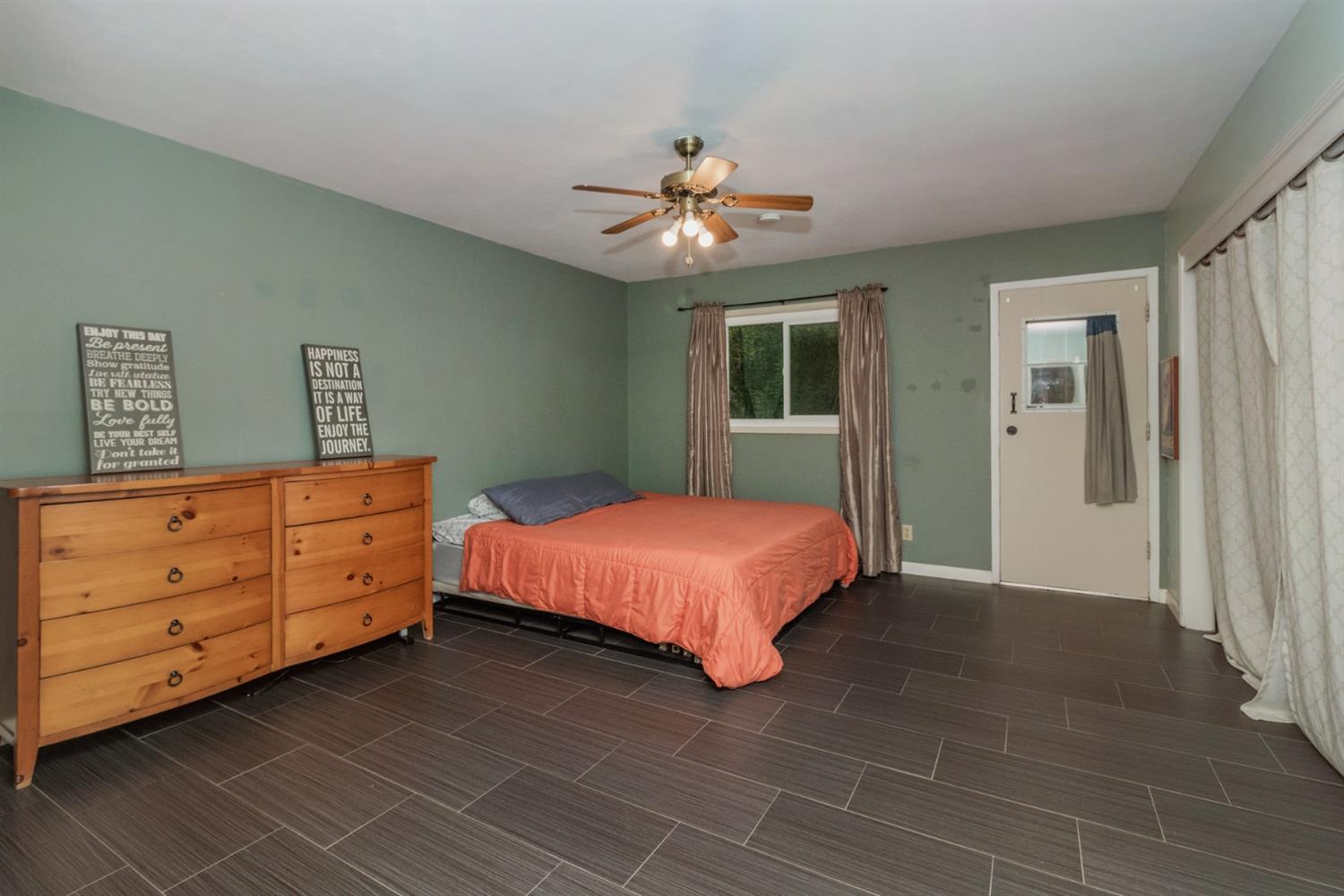 1783 North De Wolf Avenue Clovis, CA 93619 - Photo 16 of 39 a bedroom with a bed and a dresser