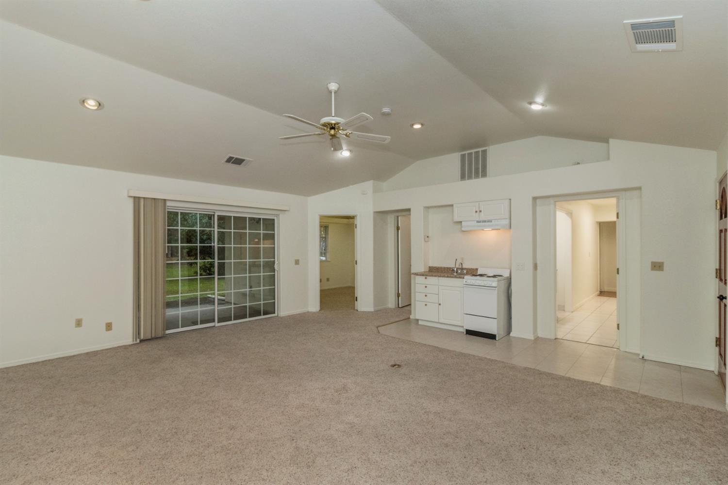 1783 North De Wolf Avenue Clovis, CA 93619 - Photo 7 of 39 a view of an empty room with a kitchen