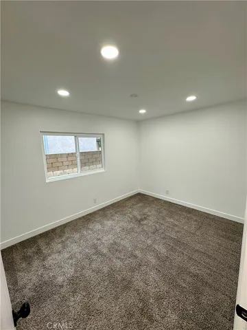 an empty room with a empty space and window