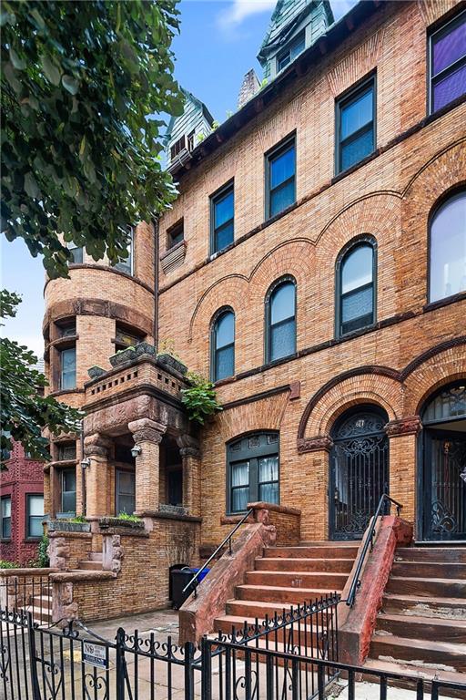 677 Saint Marks Avenue Brooklyn, NY 11216 - Photo 1 of 18 a front view of a building with balcony