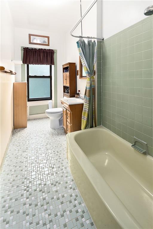 677 Saint Marks Avenue Brooklyn, NY 11216 - Photo 9 of 18 a bathroom with a bathtub and a shower