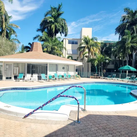 a house with swimming pool in front of it