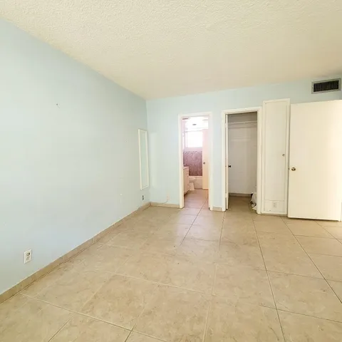 an empty room with a bathroom