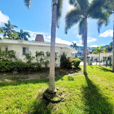 a view of a garden with a fountain
