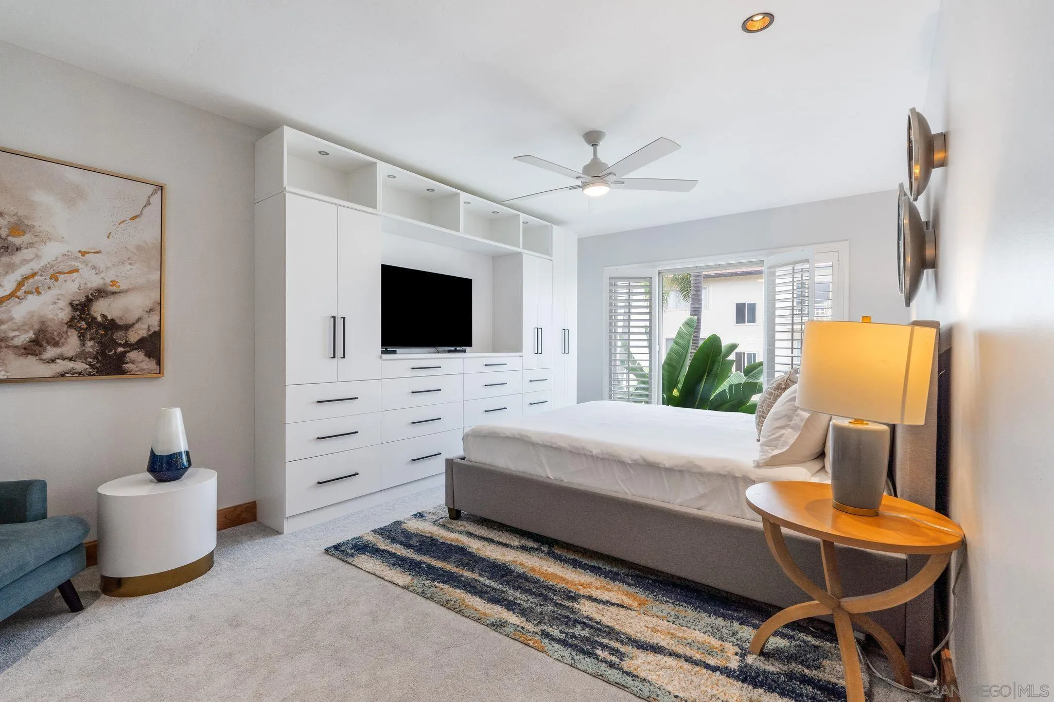 220 Coast Boulevard, Unit 2D La Jolla, CA 92037 - Photo 15 of 35 a living room with furniture and a flat screen tv
