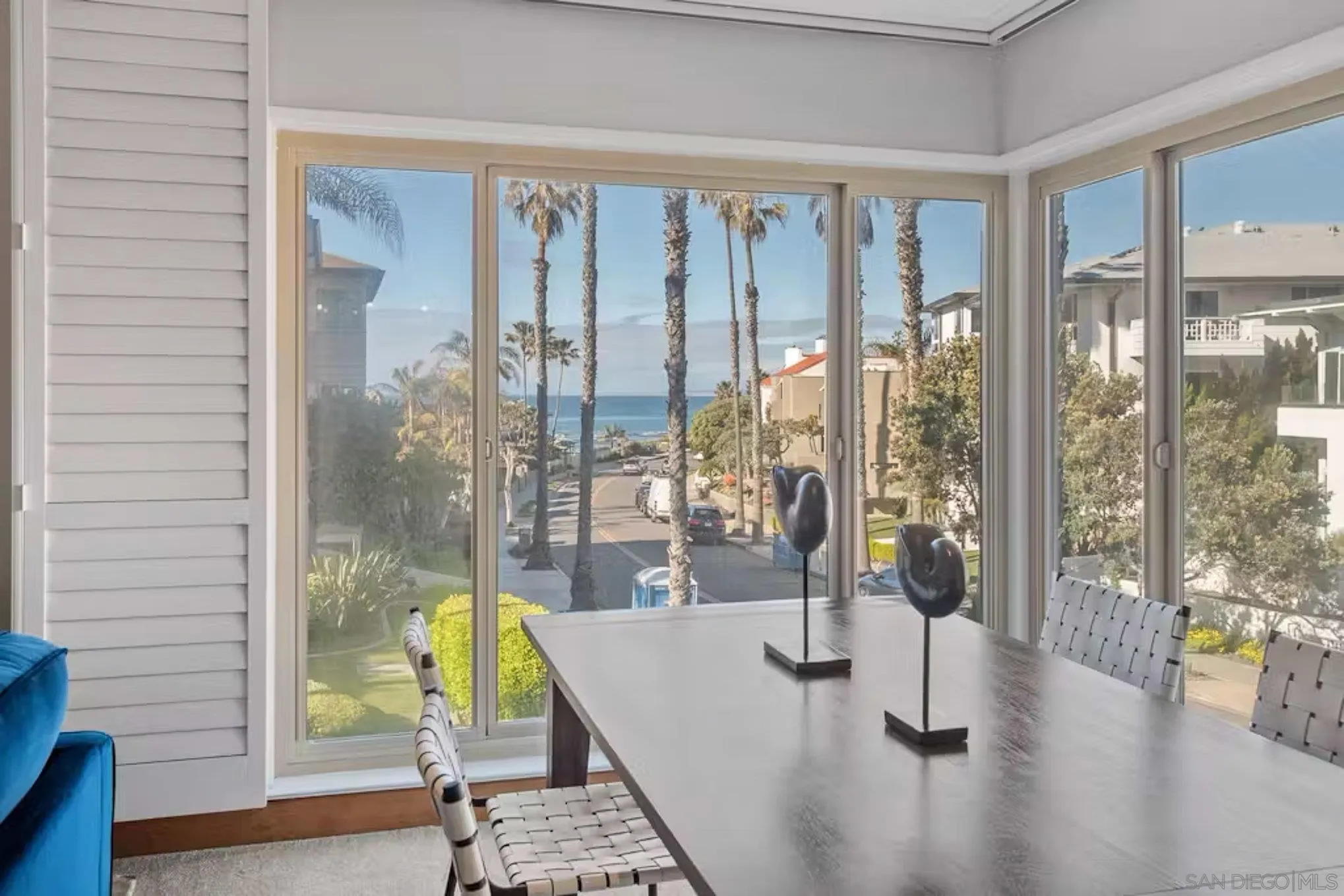 220 Coast Boulevard, Unit 2D La Jolla, CA 92037 - Photo 8 of 35 a living room with furniture and a floor to ceiling window