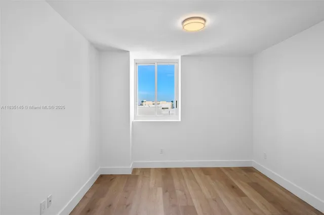 a view of a hallway with washer and dryer