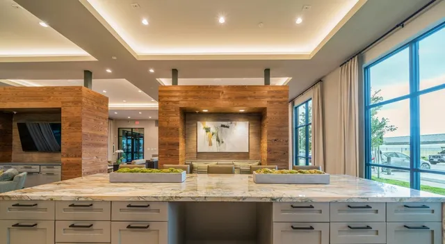 a kitchen with a sink stove and cabinets