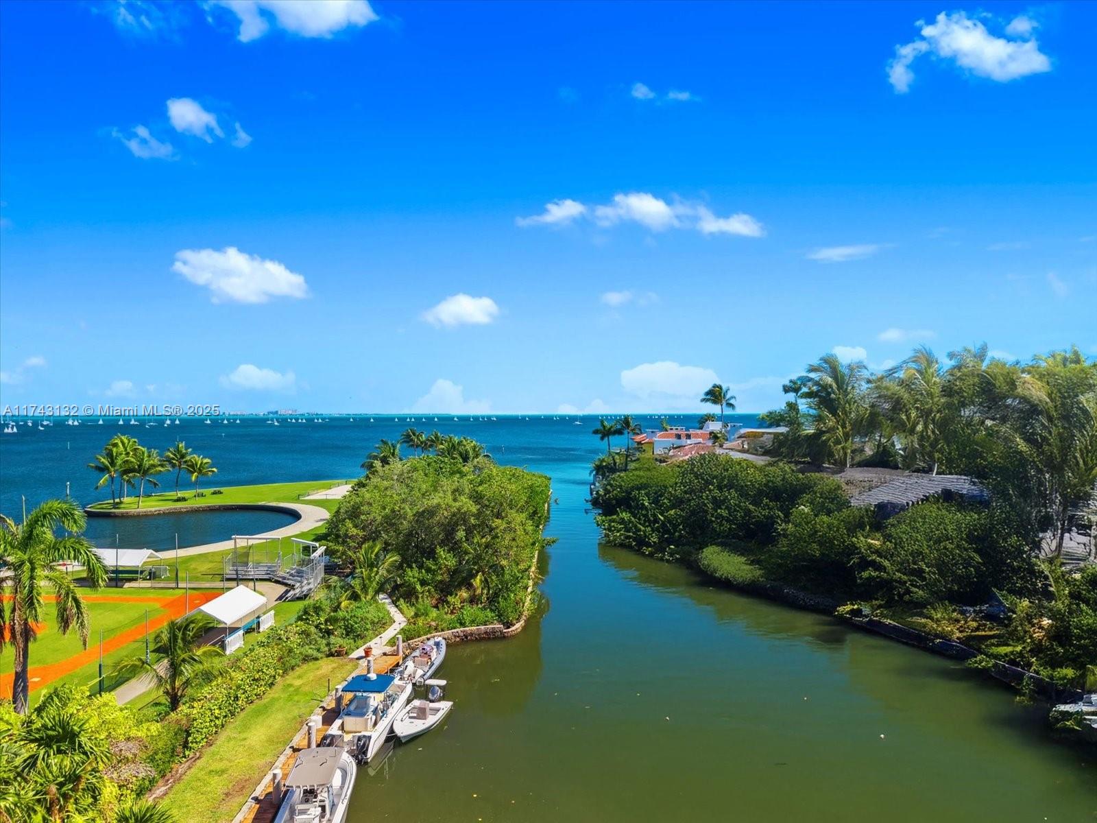 a view of a lake with lawn chairs