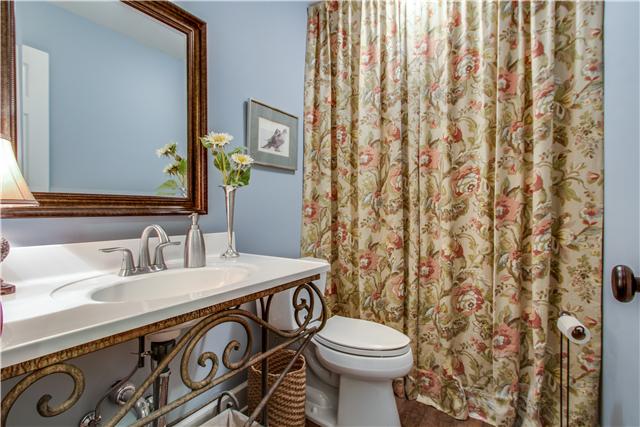1305 General George Patton Road Nashville, TN 37221 - Photo 8 of 17 Downstairs full bath with handsome wrought iron pedestal sink.