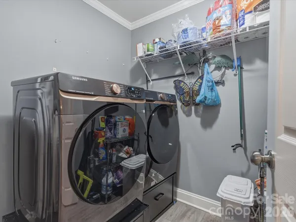 a utility room with dryer and washer