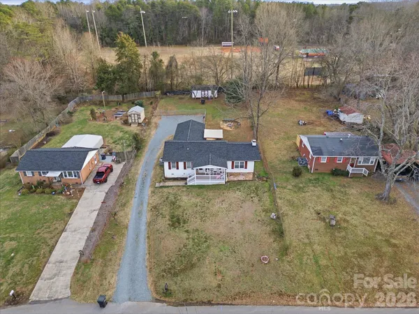 a aerial view of a house with swimming pool