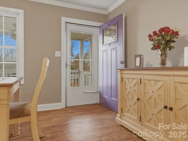a view of entryway with wooden floor