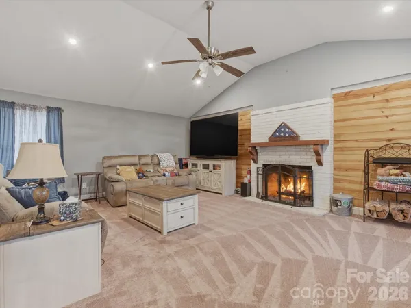 a living room with furniture and a fireplace