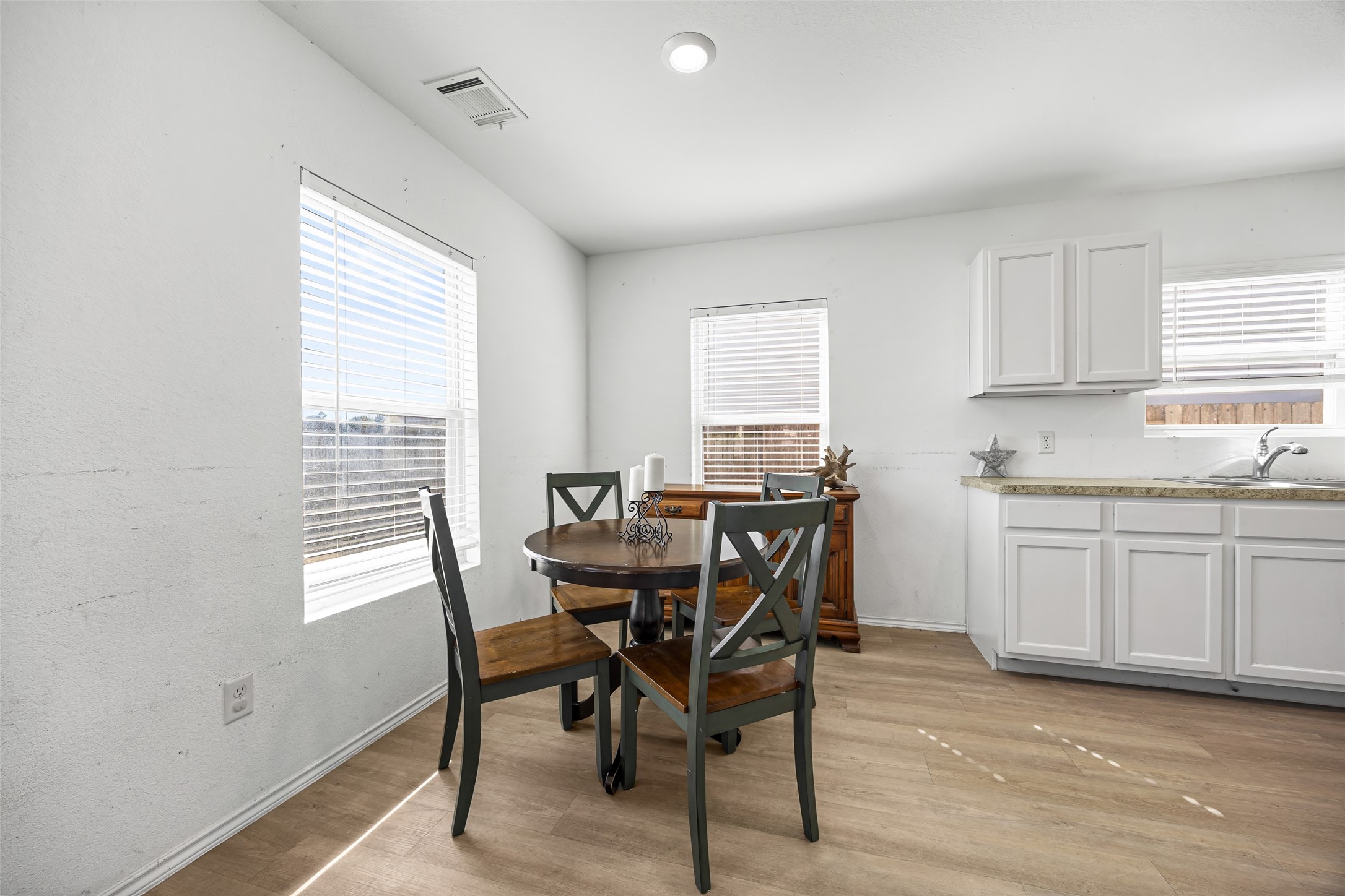 5976 Rimini Landing Lane Porter, TX 77365 - Photo 10 of 18 a view of a dining room with furniture and window