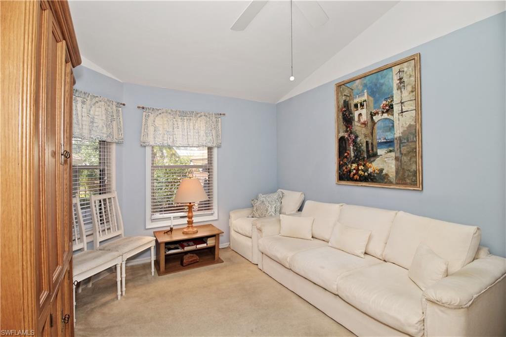 4028 Crayton Road, Unit C3 Naples, FL 34103 - Photo 12 of 32 a living room with furniture and a large window