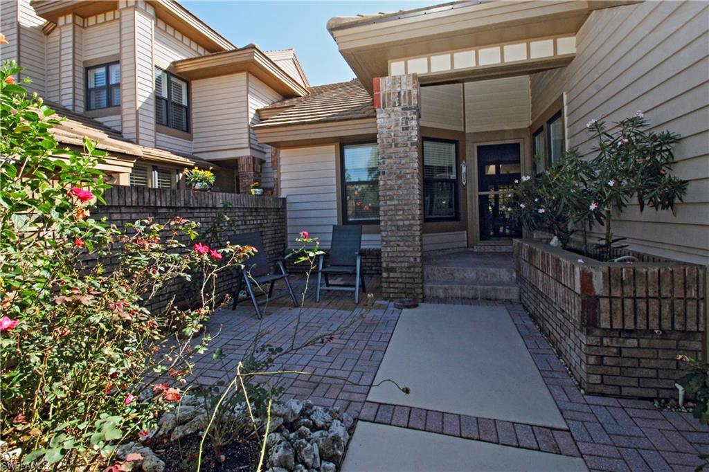 4028 Crayton Road, Unit C3 Naples, FL 34103 - Photo 2 of 32 a view of a house with a patio