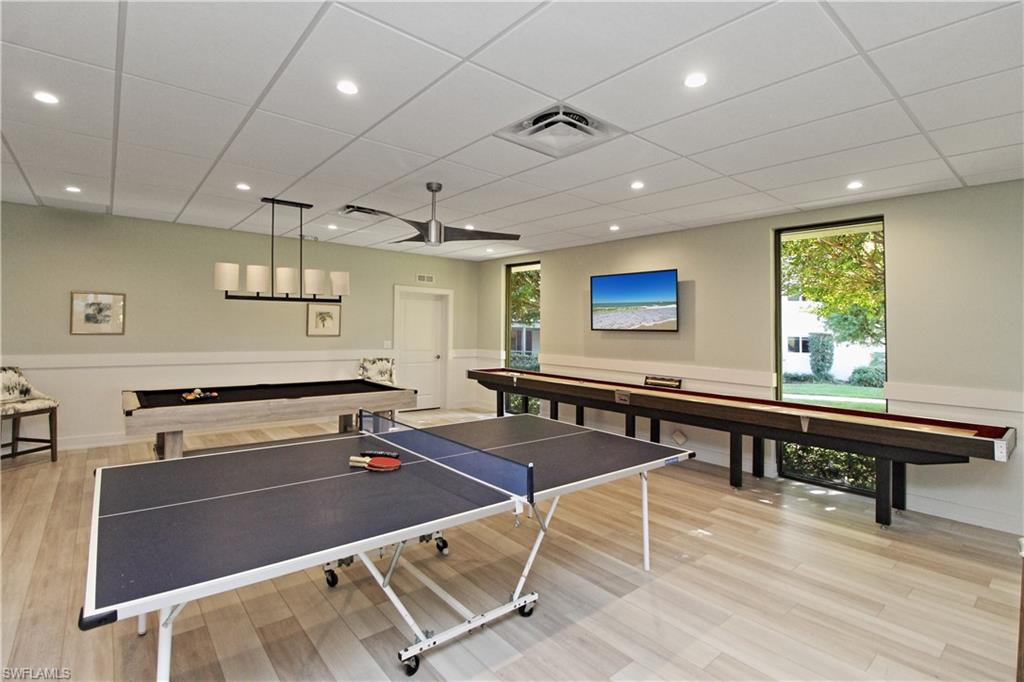 4028 Crayton Road, Unit C3 Naples, FL 34103 - Photo 22 of 32 a room with gym equipment pool table room