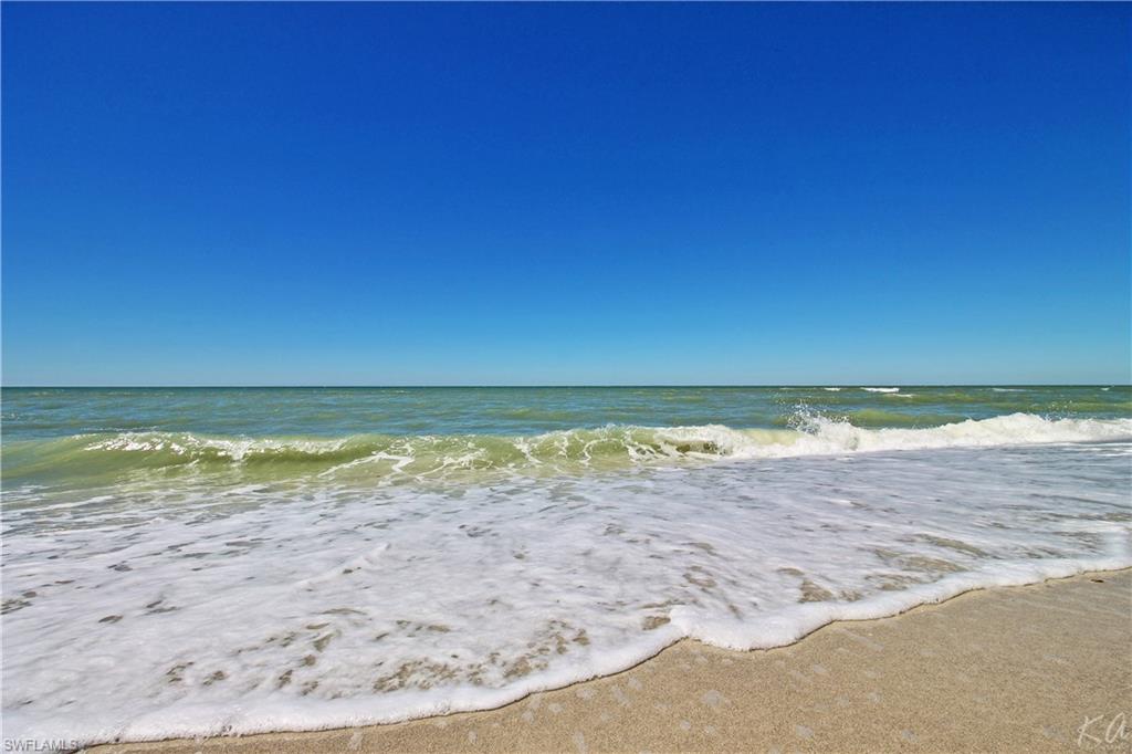 4028 Crayton Road, Unit C3 Naples, FL 34103 - Photo 27 of 32 a view of beach and ocean