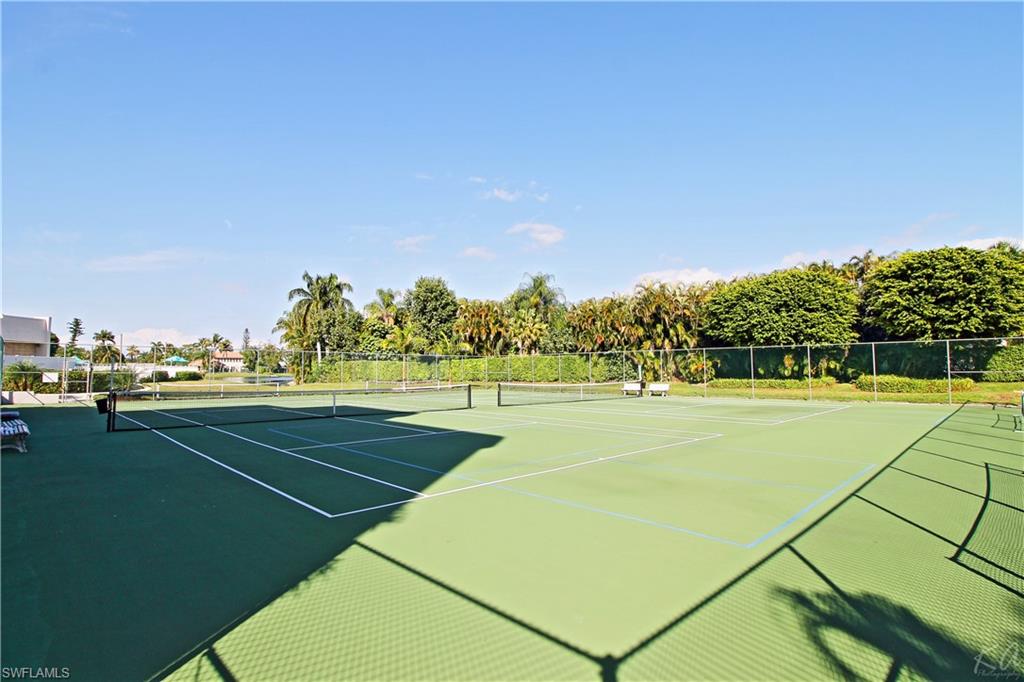4028 Crayton Road, Unit C3 Naples, FL 34103 - Photo 28 of 32 a view of an outdoor space and tennis court