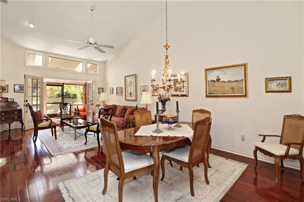 4028 Crayton Road, Unit C3 Naples, FL 34103 - Photo 6 of 32 a view of a dining room with furniture window and wooden floor