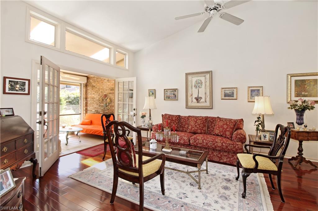 4028 Crayton Road, Unit C3 Naples, FL 34103 - Photo 9 of 32 a living room with furniture and a window