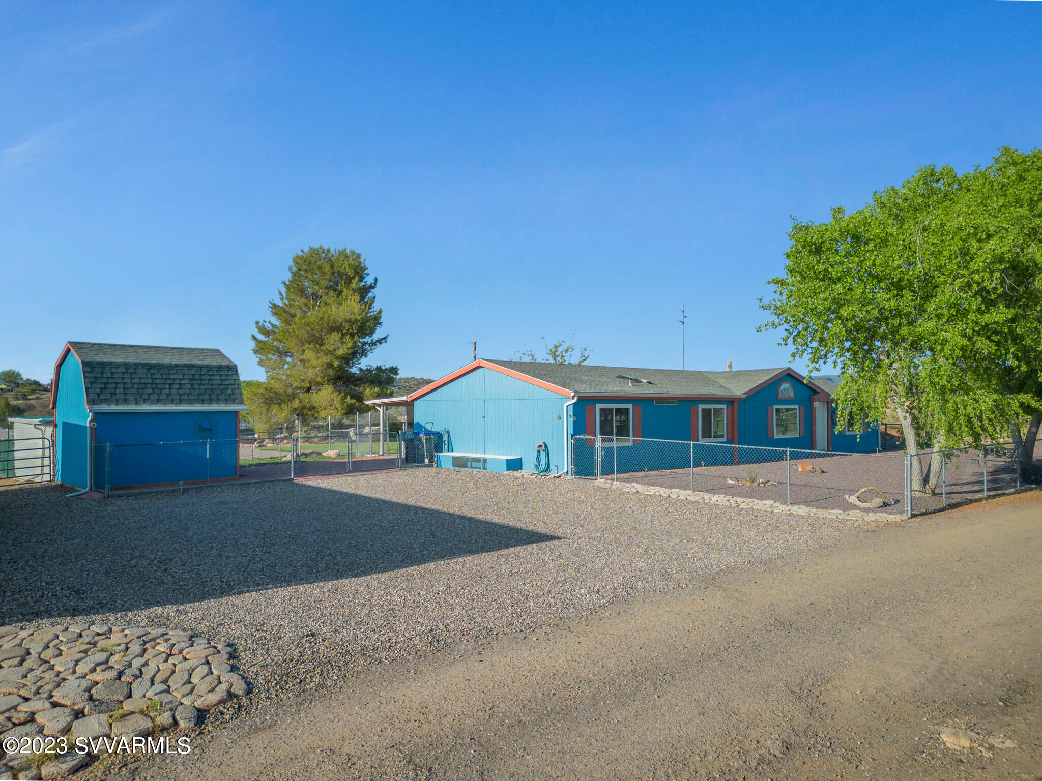 3730 East Beaver Creek Road Rimrock, AZ 86335 - Photo 17 of 49 a front view of a house with a yard and garage