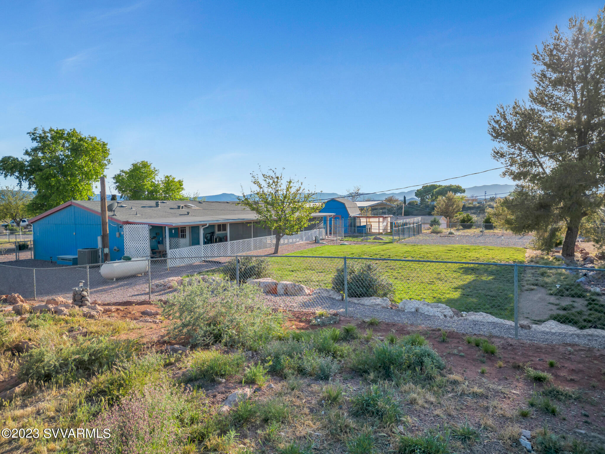3730 East Beaver Creek Road Rimrock, AZ 86335 - Photo 24 of 49 a view of swimming pool with outdoor seating and yard