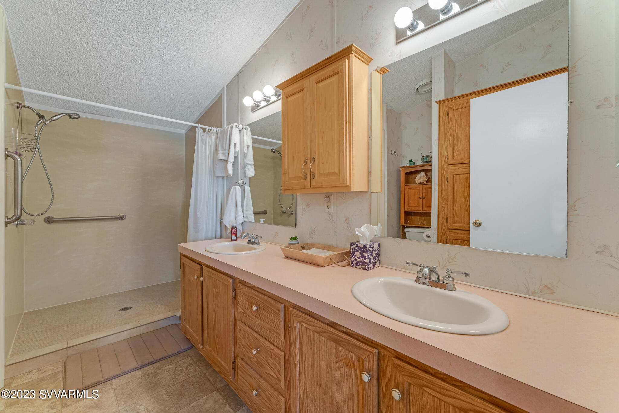 3730 East Beaver Creek Road Rimrock, AZ 86335 - Photo 31 of 49 a bathroom with a sink double vanity and a shower