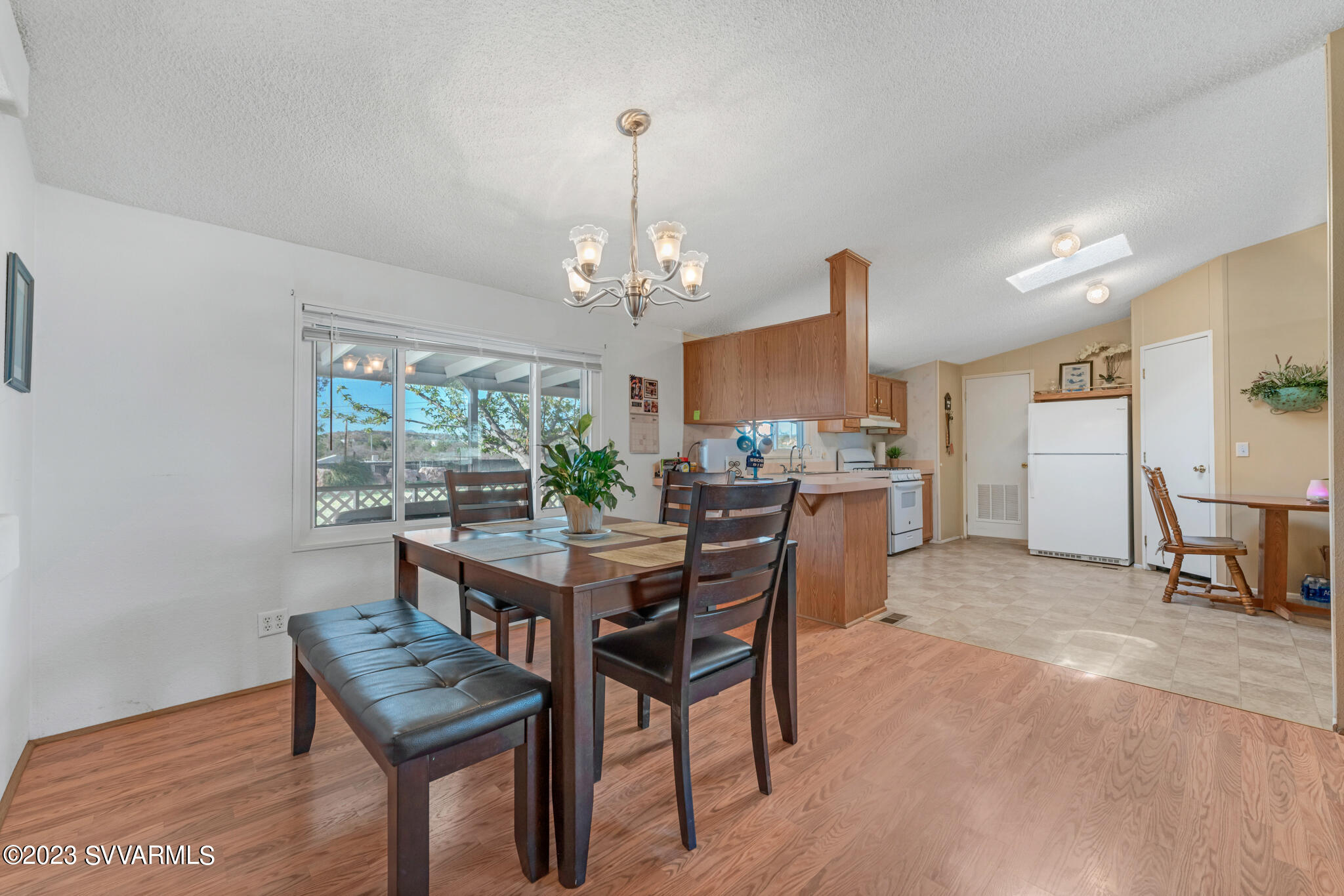 3730 East Beaver Creek Road Rimrock, AZ 86335 - Photo 42 of 49 a view of a dining room with furniture and chandelier