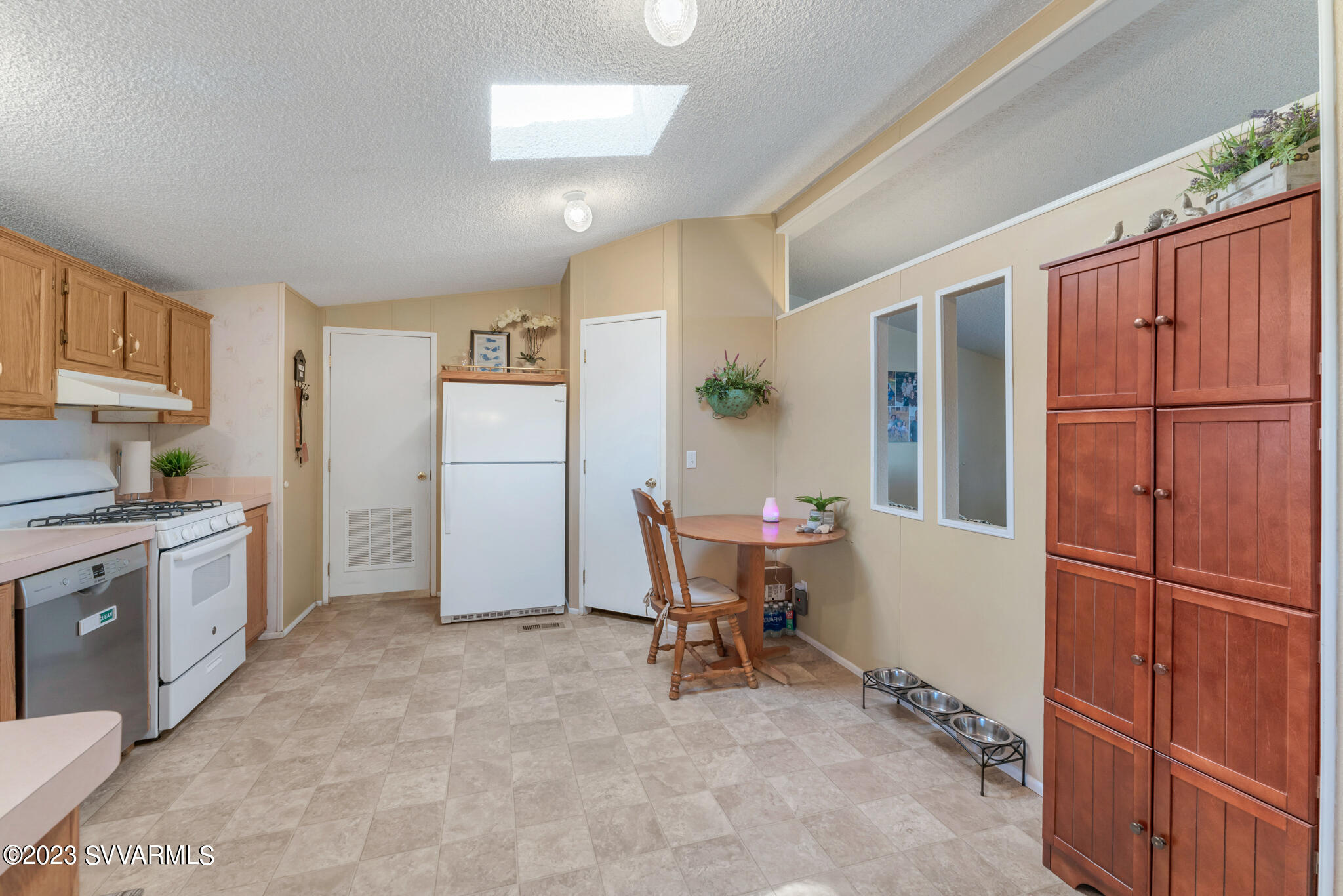 3730 East Beaver Creek Road Rimrock, AZ 86335 - Photo 47 of 49 a kitchen with refrigerator cabinets and furniture