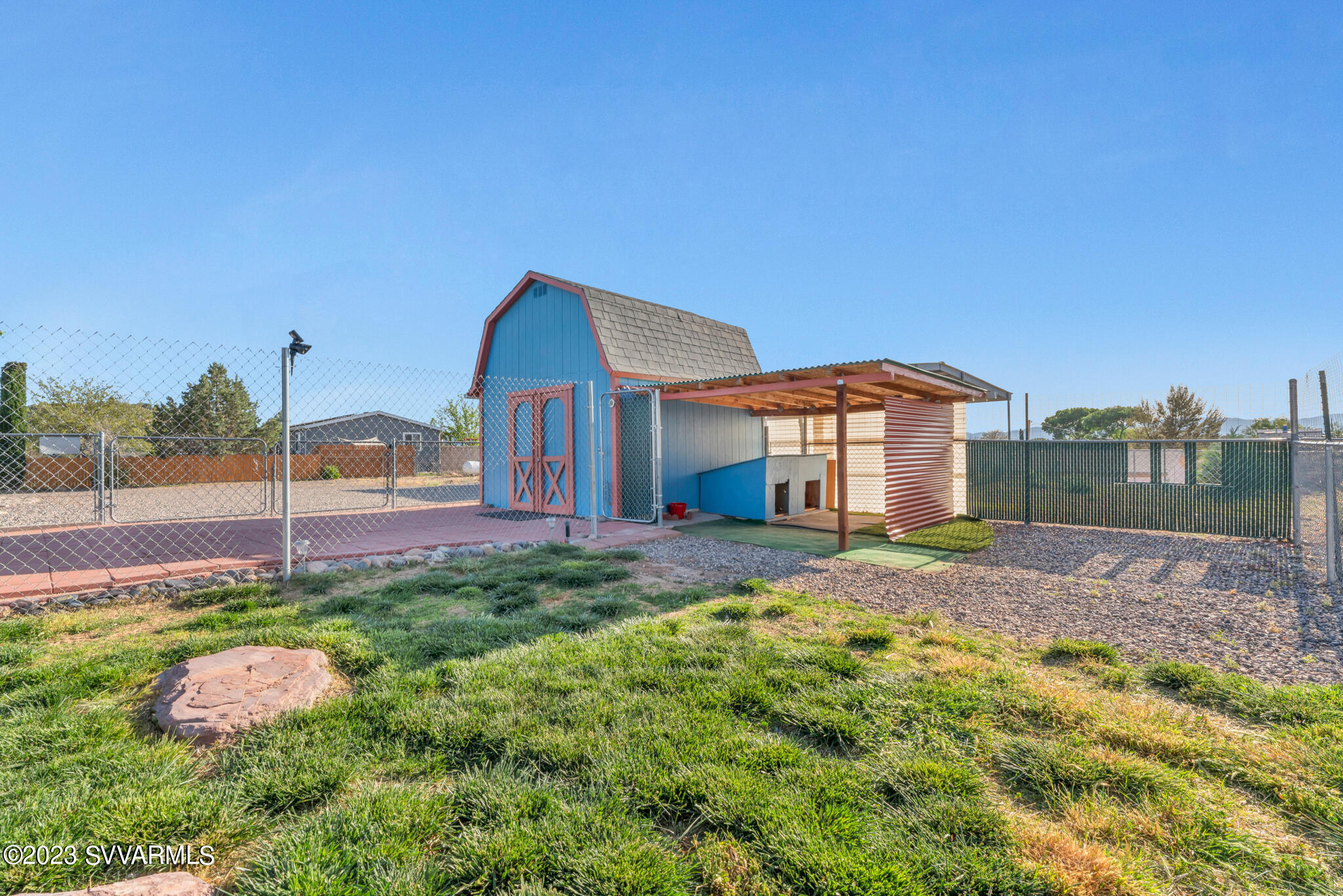 3730 East Beaver Creek Road Rimrock, AZ 86335 - Photo 7 of 49 a front view of a house with a yard and garage