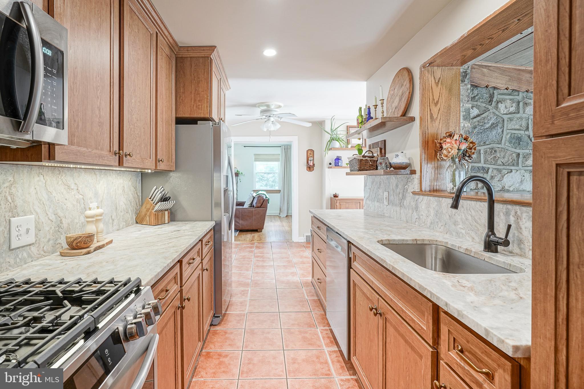 64 Pancoast Boulevard Delran, NJ 08075 - Photo 17 of 45 a kitchen with stainless steel appliances granite countertop a sink stove and cabinets
